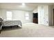 Large main bedroom with plush carpet and ample natural light at 3877 Oakman Pl, Fairburn, GA 30213