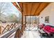 Covered back porch with seating and string lights at 511 Laird Rd, Hiram, GA 30141