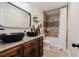 Bathroom with double vanity, black vessel sinks, and a shower/tub combo at 511 Laird Rd, Hiram, GA 30141