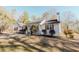 White farmhouse exterior with a covered porch and manicured lawn at 511 Laird Rd, Hiram, GA 30141