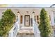 Inviting front porch with white railings and stylish lanterns at 511 Laird Rd, Hiram, GA 30141