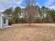 Spacious backyard with mature trees and open space at 11868 Fairway Overlook, Fayetteville, GA 30215