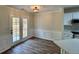 Dining area with hardwood floors and view of kitchen at 11868 Fairway Overlook, Fayetteville, GA 30215