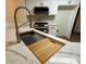 Kitchen island with integrated cutting board and sink at 11868 Fairway Overlook, Fayetteville, GA 30215