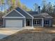 Gray house with white accents and a two-car garage at 2259 Old Yorkville Rd, Dallas, GA 30157