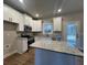 Spacious kitchen with granite countertops and an island at 2259 Old Yorkville Rd, Dallas, GA 30157