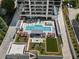 Stunning rooftop amenities featuring pool, spa, firepit, and outdoor lounge areas with lush landscaping at 2520 Peachtree Nw Rd # 1202, Atlanta, GA 30305
