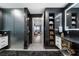 Elegant bathroom featuring a sleek vanity, glass shower, and open shelving for towel storage at 2520 Peachtree Nw Rd # 1202, Atlanta, GA 30305