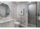Stylish bathroom featuring unique wallpaper, a modern vanity, and a sleek glass-enclosed shower for a luxurious feel at 2520 Peachtree Nw Rd # 1202, Atlanta, GA 30305