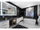 This modern bathroom features a soaking tub, luxury finishes, and a makeup vanity at 2520 Peachtree Nw Rd # 1202, Atlanta, GA 30305