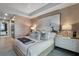 Bright Primary bedroom with a king-size bed, accent lighting, and stylish decor at 2520 Peachtree Nw Rd # 1202, Atlanta, GA 30305