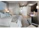 Well-lit bedroom with a king bed, and a decorative fireplace at 2520 Peachtree Nw Rd # 1202, Atlanta, GA 30305