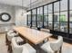 Elegant conference room with a large wooden table, comfortable seating, and stylish lighting fixtures at 2520 Peachtree Nw Rd # 1202, Atlanta, GA 30305