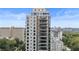 View of the building with modern design, expansive balconies, and city views at 2520 Peachtree Nw Rd # 1202, Atlanta, GA 30305