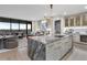 Designer kitchen featuring an island with seating and views into the living area at 2520 Peachtree Nw Rd # 1202, Atlanta, GA 30305