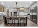 Modern kitchen with expansive marble island and breakfast bar seating at 2520 Peachtree Nw Rd # 1202, Atlanta, GA 30305