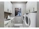 Functional laundry room with modern appliances and ample storage at 2520 Peachtree Nw Rd # 1202, Atlanta, GA 30305