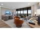 Bright living room with stylish furniture, large windows, and a view of the landscape at 2520 Peachtree Nw Rd # 1202, Atlanta, GA 30305
