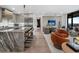 Bright open-concept living space connects a gourmet kitchen to a stylishly furnished seating area at 2520 Peachtree Nw Rd # 1202, Atlanta, GA 30305