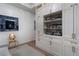 Bright living room showcases custom built-ins, creating a cozy space for storage and display at 2520 Peachtree Nw Rd # 1202, Atlanta, GA 30305