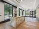 Welcoming lobby featuring marble reception desk, wood floors, modern lighting, and large windows at 2520 Peachtree Nw Rd # 1202, Atlanta, GA 30305