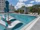 Resort-style pool with lounge chairs and a covered seating area at 2520 Peachtree Nw Rd # 1202, Atlanta, GA 30305