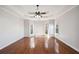 Large room featuring windows and hardwood floors with a ceiling fan at 811 Somersby Dr, Dallas, GA 30157