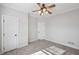 Bright bedroom featuring plush carpet, a ceiling fan, and neutral paint at 811 Somersby Dr, Dallas, GA 30157