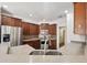 Kitchen featuring stainless steel appliances, granite countertops and wood cabinetry at 811 Somersby Dr, Dallas, GA 30157