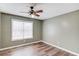 Bedroom featuring a ceiling fan and a window providing natural light at 93 Highway 81, Oxford, GA 30054