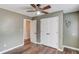 Bedroom showcasing a ceiling fan, closet, and a connecting door at 93 Highway 81, Oxford, GA 30054