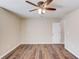 Bright bedroom with a ceiling fan and wood floors at 93 Highway 81, Oxford, GA 30054