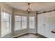 Eat-in kitchen area with multiple windows offering natural light and a barn door at 93 Highway 81, Oxford, GA 30054