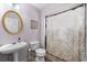 Bathroom with pedestal sink, toilet and shower/tub combo at 101 Oliver Ct, Douglasville, GA 30134