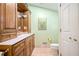 Elegant bathroom with double vanity, toilet, and wood cabinets at 1359 Ragley Hall Ne Rd, Brookhaven, GA 30319