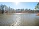 Sunny view across the calm lake waters at 1359 Ragley Hall Ne Rd, Brookhaven, GA 30319