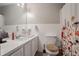 Bathroom with large mirror and floral shower curtain. White subway tile and soft lighting at 1619 Ridgeview Nw Dr, Conyers, GA 30012