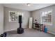 Bedroom with carpet, two windows, desk, mirror, and a Century freestanding punching bag at 1619 Ridgeview Nw Dr, Conyers, GA 30012