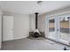 Cozy living room featuring a fireplace and French doors leading to the backyard at 1619 Ridgeview Nw Dr, Conyers, GA 30012