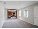 Bright living room with neutral walls showcasing a view to the connected den space at 1619 Ridgeview Nw Dr, Conyers, GA 30012