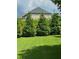 Landscaped backyard with lush greenery and privacy fence at 4240 Hunters Walk Way, Cumming, GA 30028