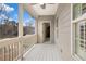 Spacious balcony with white wooden flooring and a view of the backyard at 4535 Meadow Green Ln, Acworth, GA 30101