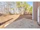 Backyard concrete patio with wooded area at 8270 Mossybrook Ln, Douglasville, GA 30135