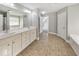 Spacious bathroom with double vanity, soaking tub, and neutral finishes at 8270 Mossybrook Ln, Douglasville, GA 30135