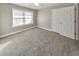 Comfortable bedroom with carpet flooring and a ceiling fan at 8270 Mossybrook Ln, Douglasville, GA 30135