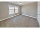 Neutral bedroom with ceiling fan and window at 8270 Mossybrook Ln, Douglasville, GA 30135