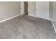 Neutral bedroom features gray walls, plush carpet, and a double door closet at 8270 Mossybrook Ln, Douglasville, GA 30135