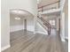 Open concept foyer with hardwood flooring and a staircase at 8270 Mossybrook Ln, Douglasville, GA 30135