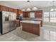 Modern kitchen with stainless steel appliances, a center island, and ample cabinet space at 8270 Mossybrook Ln, Douglasville, GA 30135