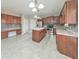 Open kitchen features stainless appliances, granite countertops, and island with wood cabinets at 8270 Mossybrook Ln, Douglasville, GA 30135